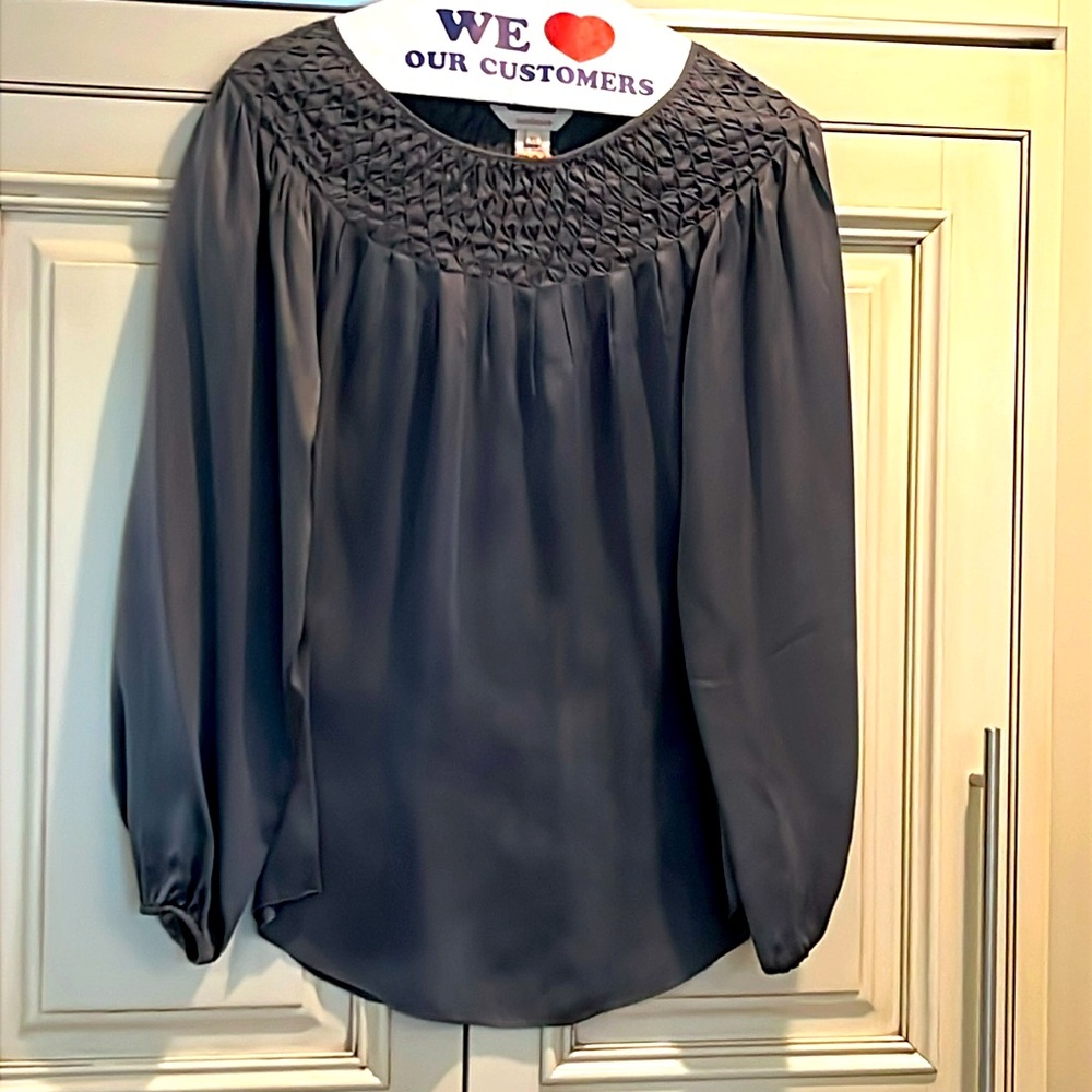 Sundance charcoal silk blouse with beautiful details around the neck.